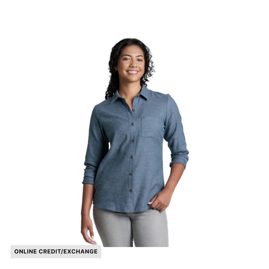 Blue button-up flannel shirt on a model with sleeves rolled to the forearms