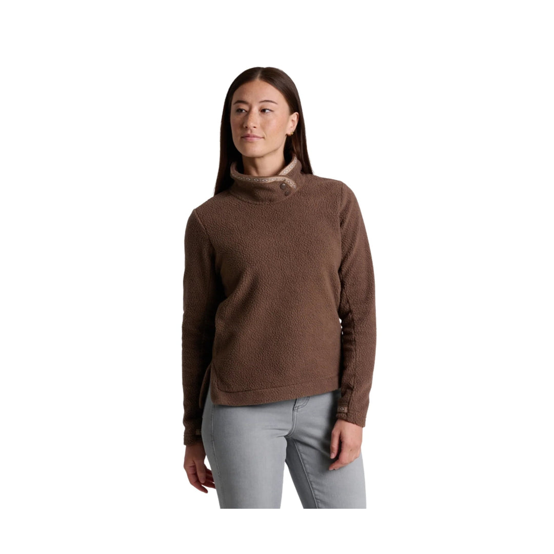 Brown fleece pullover with a snap mock neck and long sleeves, worn with light gray pants