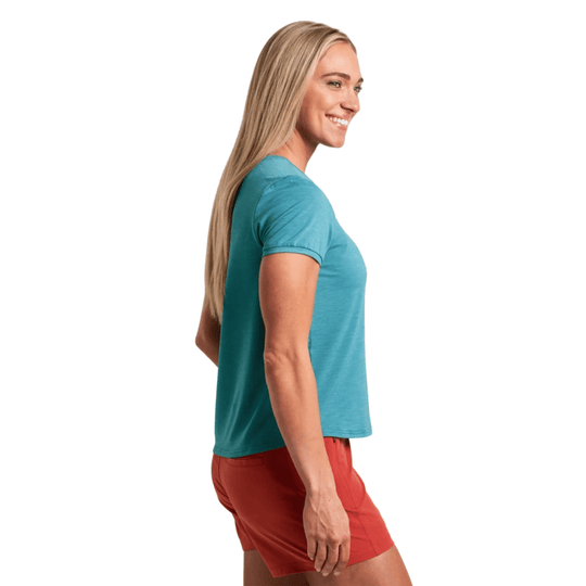Teal short-sleeve crewneck shirt shown in side view with coral shorts