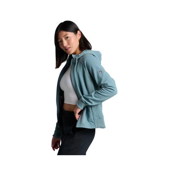 Light blue full-zip hooded jacket worn over a white top and black leggings