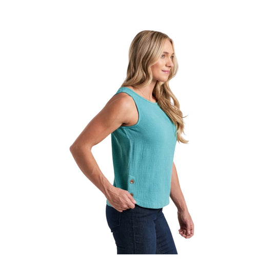 Turquoise sleeveless tank top with side button detail, shown on a model in profile
