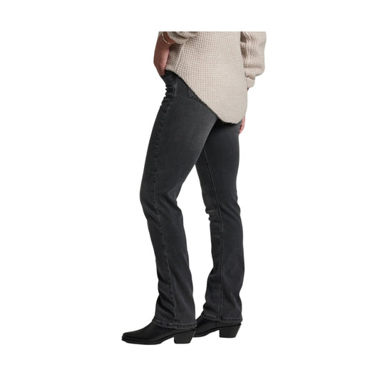 Black straight-leg jeans on a model, shown with black ankle boots and a cream sweater