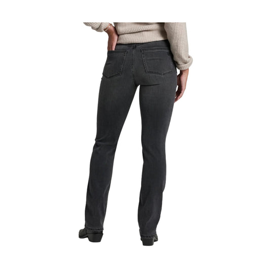 Dark straight-leg jeans shown from the back on a model