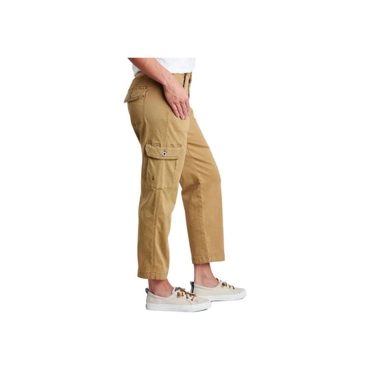 Tan cropped cargo pants with side flap pockets and white sneakers