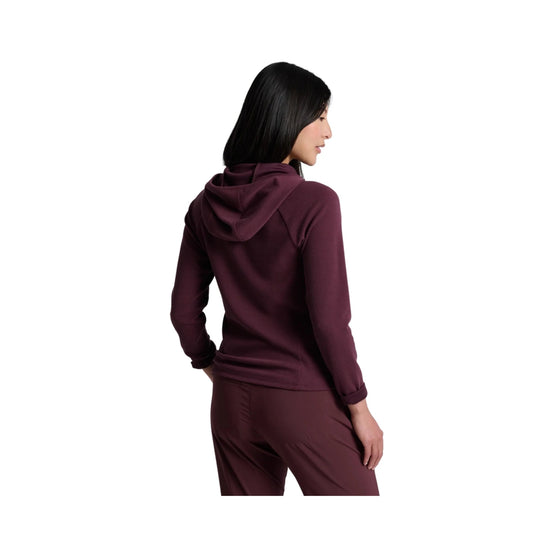 Woman wearing a burgundy hooded half-zip top and matching pants, shown from the back
