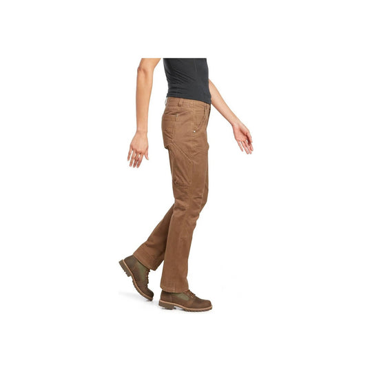 Side view of brown utility pants on a model wearing hiking boots