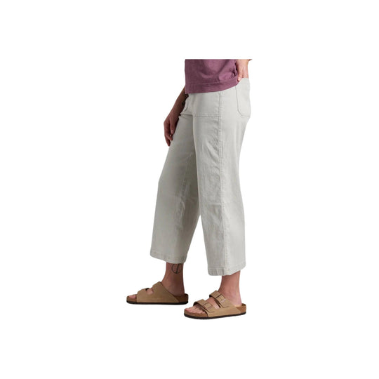 Light gray wide-leg crop pants with patch pockets, shown with tan two-strap sandals.