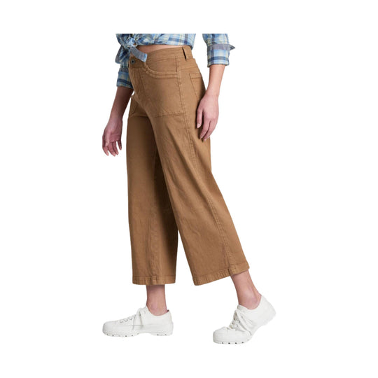 Wide-leg crop pants in tan with front pockets, shown with a plaid shirt and white sneakers