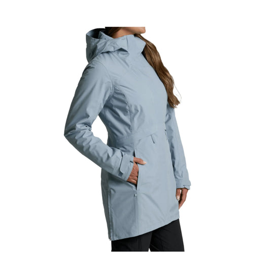 Light blue hooded insulated jacket with long hem, front pocket, and side zipper detail