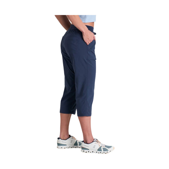 Navy pull-on capri pants with side pockets, shown on a model