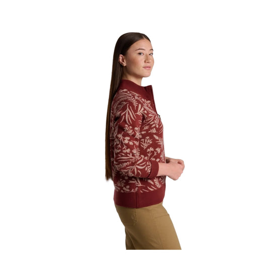 Maroon patterned sweater shown in side view on a model