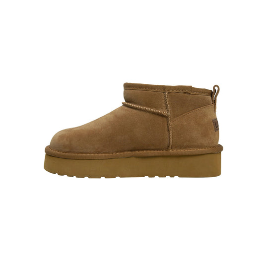 Brown suede ankle boot with a thick platform sole and pull loop at the heel