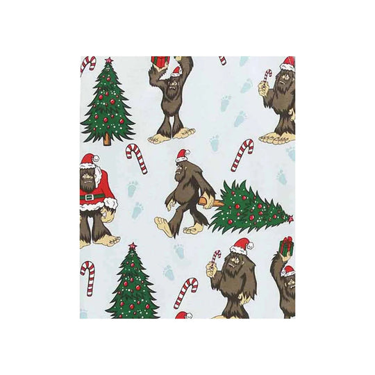 Light blue fabric with Christmas Bigfoot print, including Santa-hat Bigfoot, decorated trees, candy canes, and gift boxes