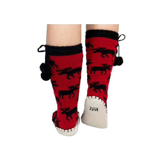 Red knit slipper socks with black animal pattern, pom-pom ties, and white soles