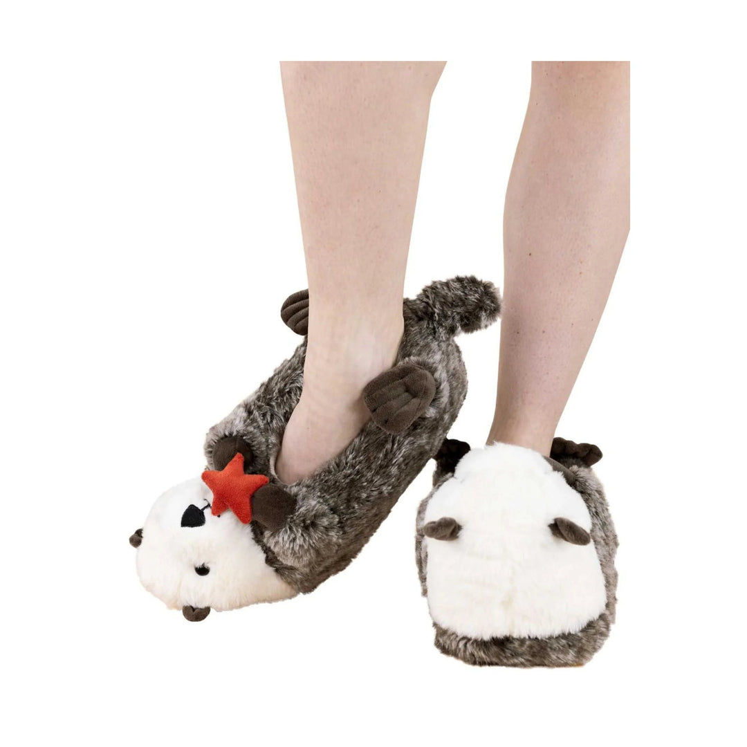 Plush animal slippers with brown-and-white fur, red star accents, and paw details worn on feet