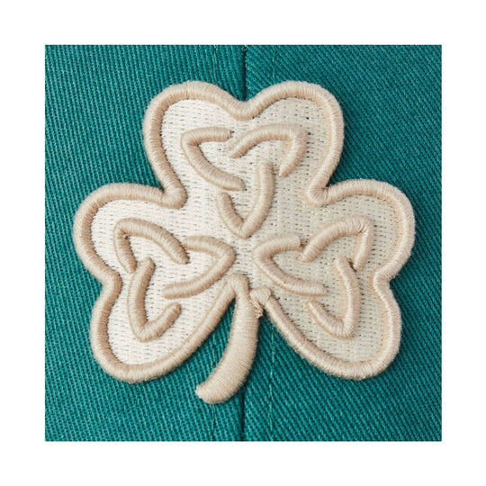 Embroidered cream Celtic clover patch on teal fabric