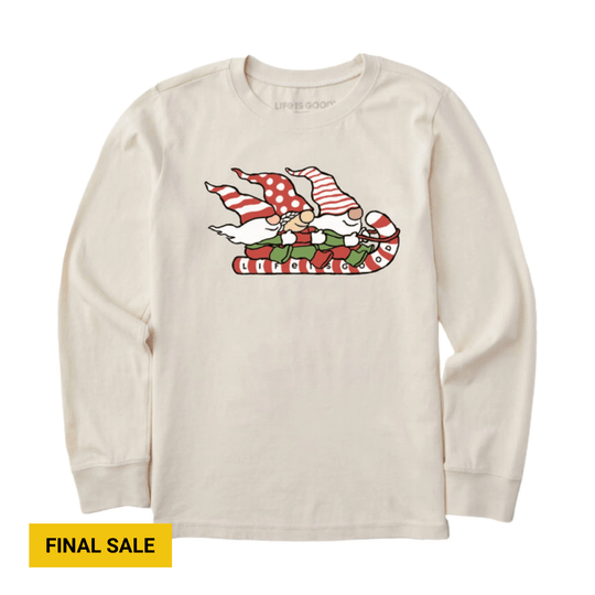 Cream long-sleeve graphic tee with a holiday gnome on a candy cane sled