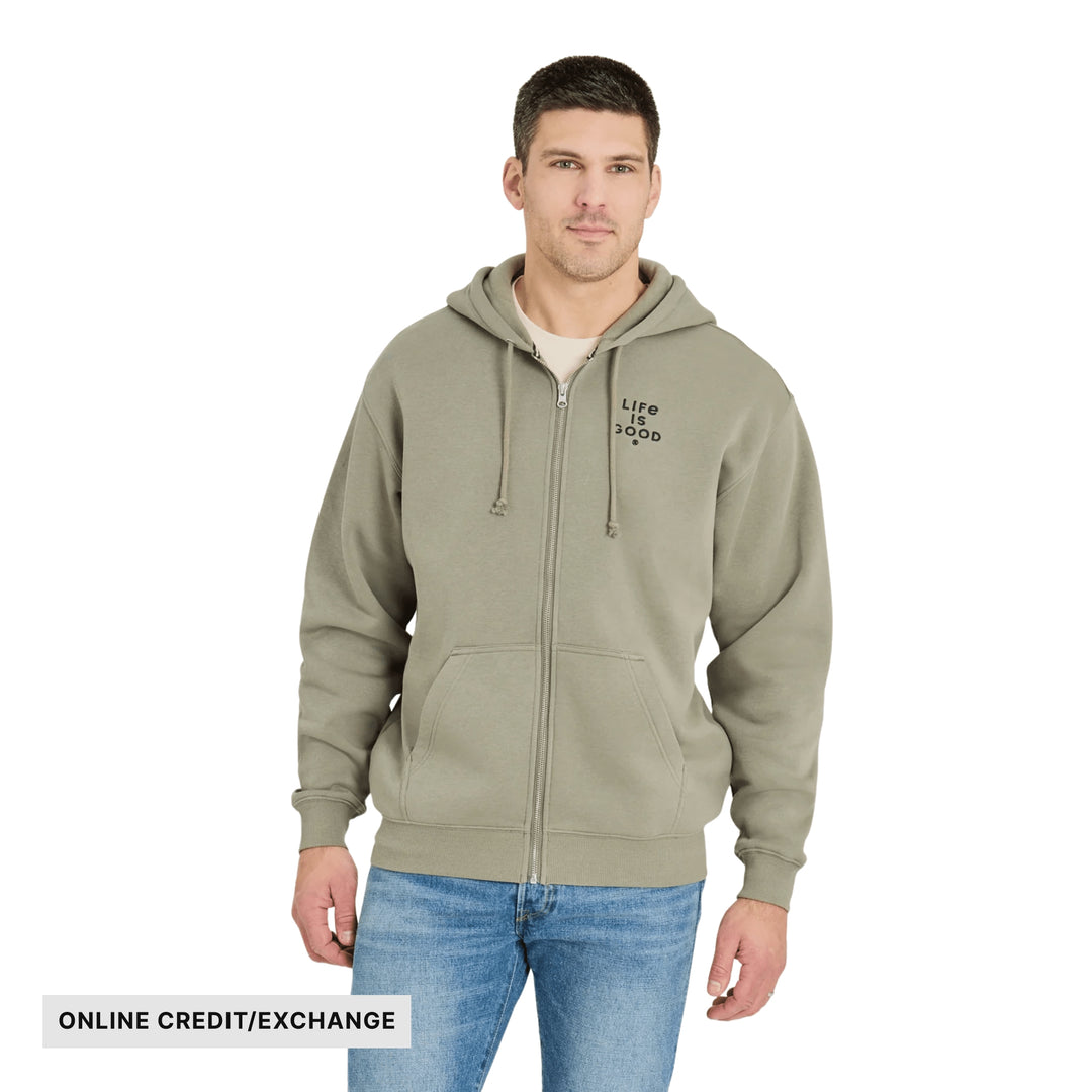 Olive zip-up hoodie with drawstrings, front pockets, and chest logo; model wears jeans