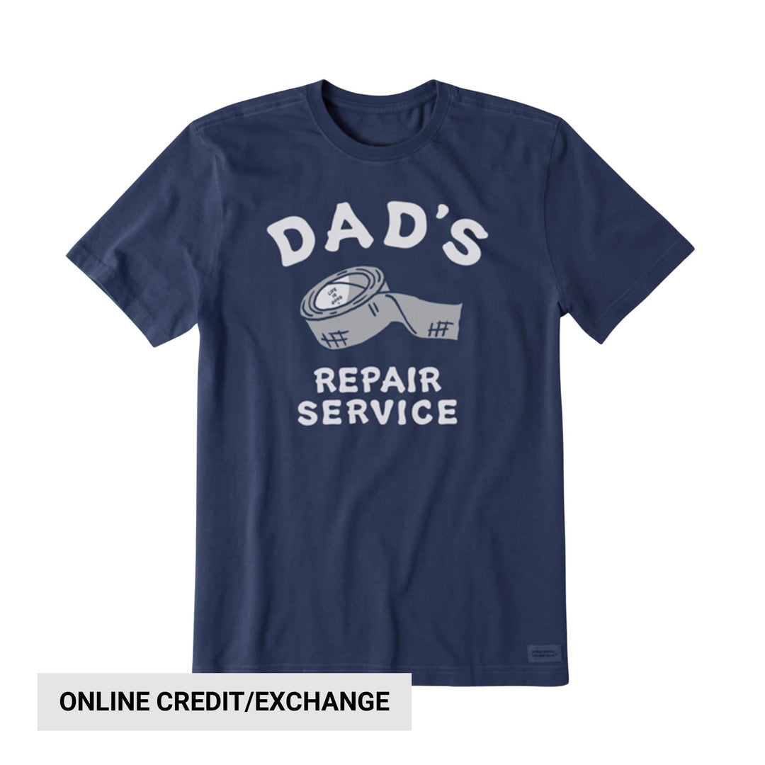 Navy short-sleeve T-shirt with arched "DAD'S" graphic, tape illustration, and "REPAIR SERVICE" text