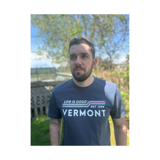 Dark blue short-sleeve T-shirt with a Vermont graphic and striped text across the chest