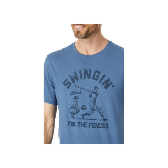 Blue graphic T-shirt with a baseball swing illustration and the text "SWINGIN' FOR THE FENCES"