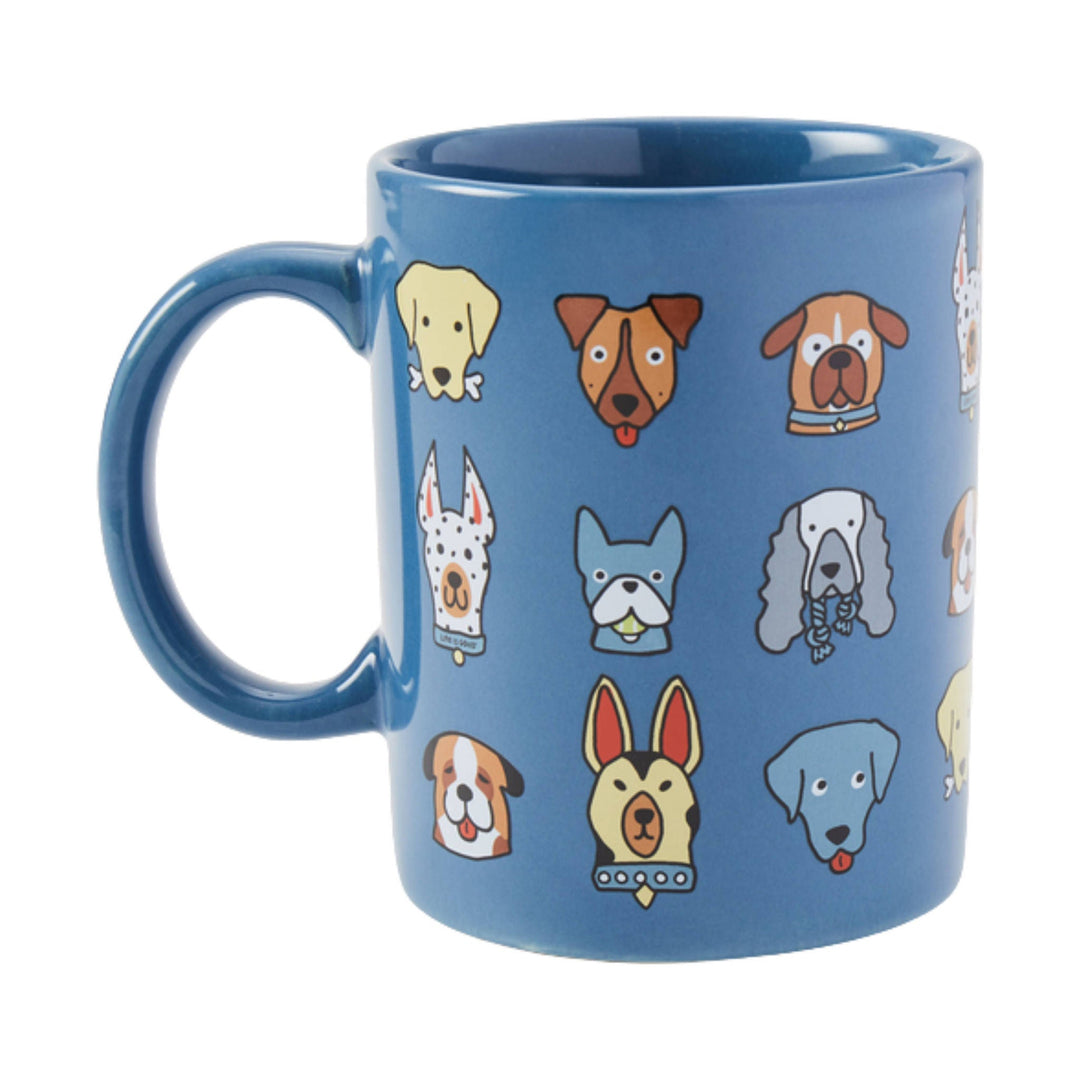 Blue ceramic mug with cartoon dog faces printed around the sides