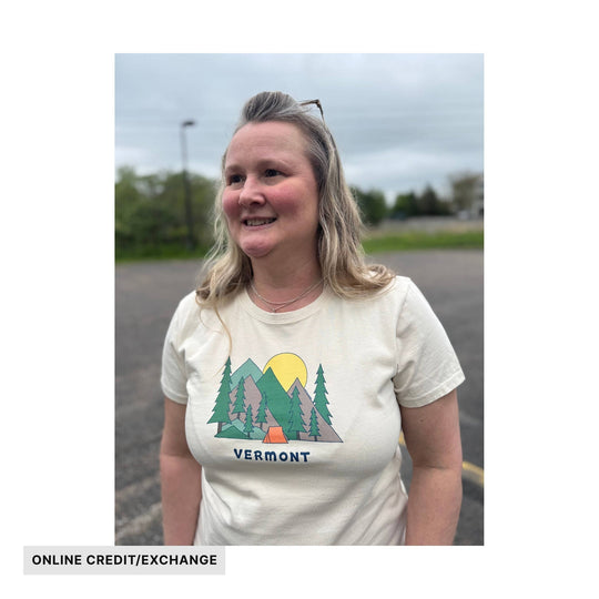 Cream T-shirt with a mountain, trees, and sunset graphic, with VERMONT text