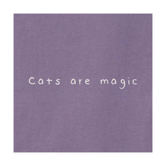 Lavender fabric with the phrase "Cats are magic" in white lettering.