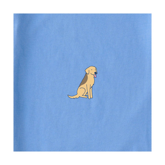Light blue boxy T-shirt with a small seated cartoon dog graphic on the chest
