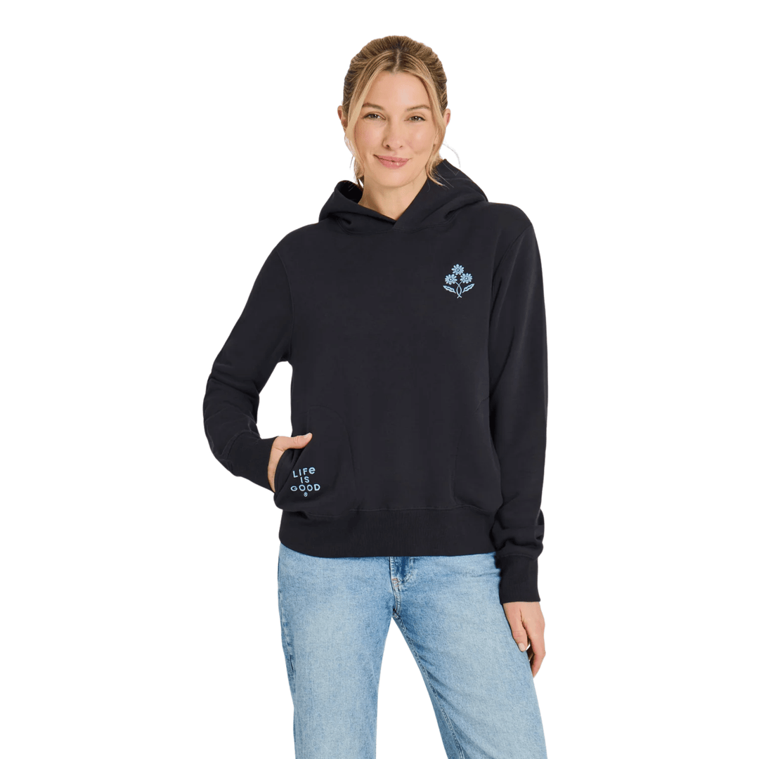 Black hooded sweatshirt with a small blue flower graphic and "Life is Good" text on the sleeve pocket
