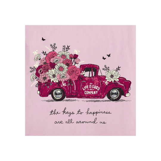 Pink graphic T-shirt with a floral pickup truck and the quote “the keys to happiness are all around us.”