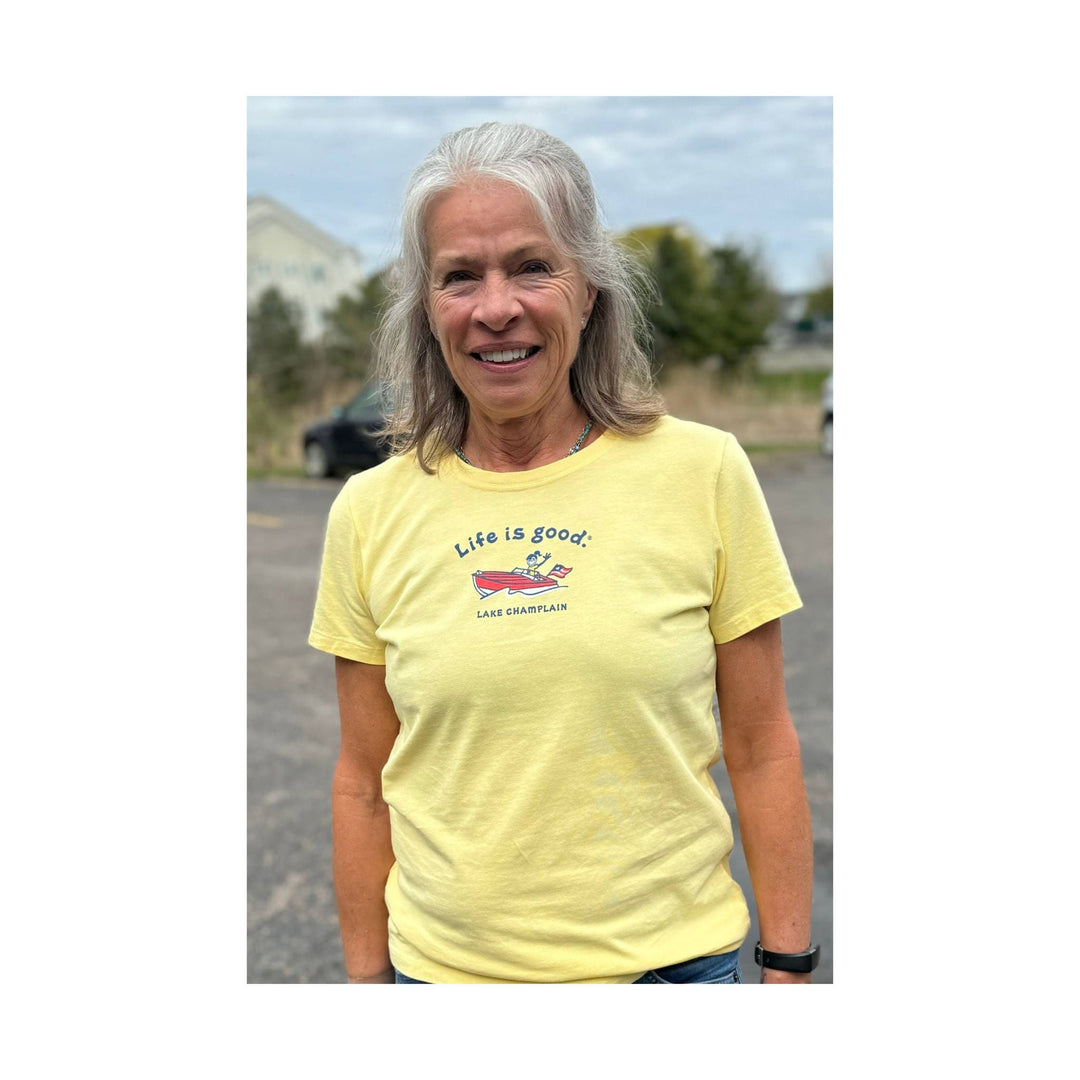 Yellow short-sleeve T-shirt with a small boat graphic and "Life is good" text