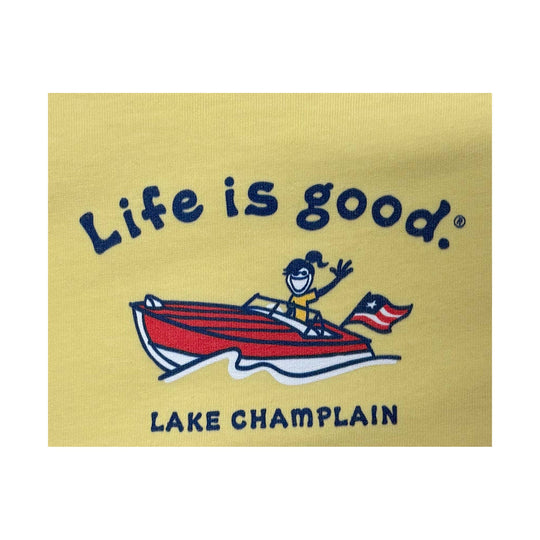 Yellow graphic T-shirt print with a red boat, waving figure, and the words “Life is good.”