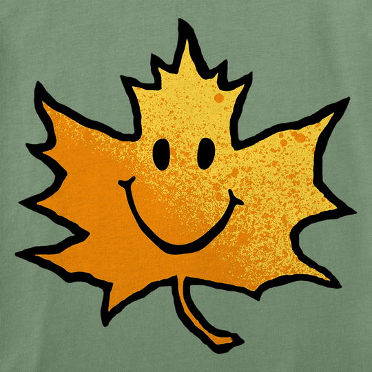Orange maple leaf graphic with a smiling face on a green background