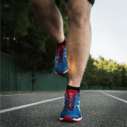 Red no-tie shoelaces on blue running shoes