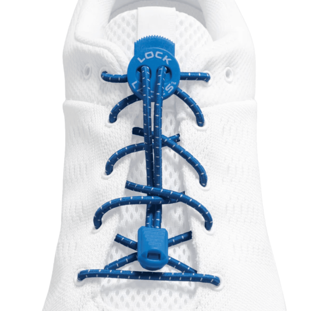 White athletic shoe lacing system with blue bungee cords and toggle closures