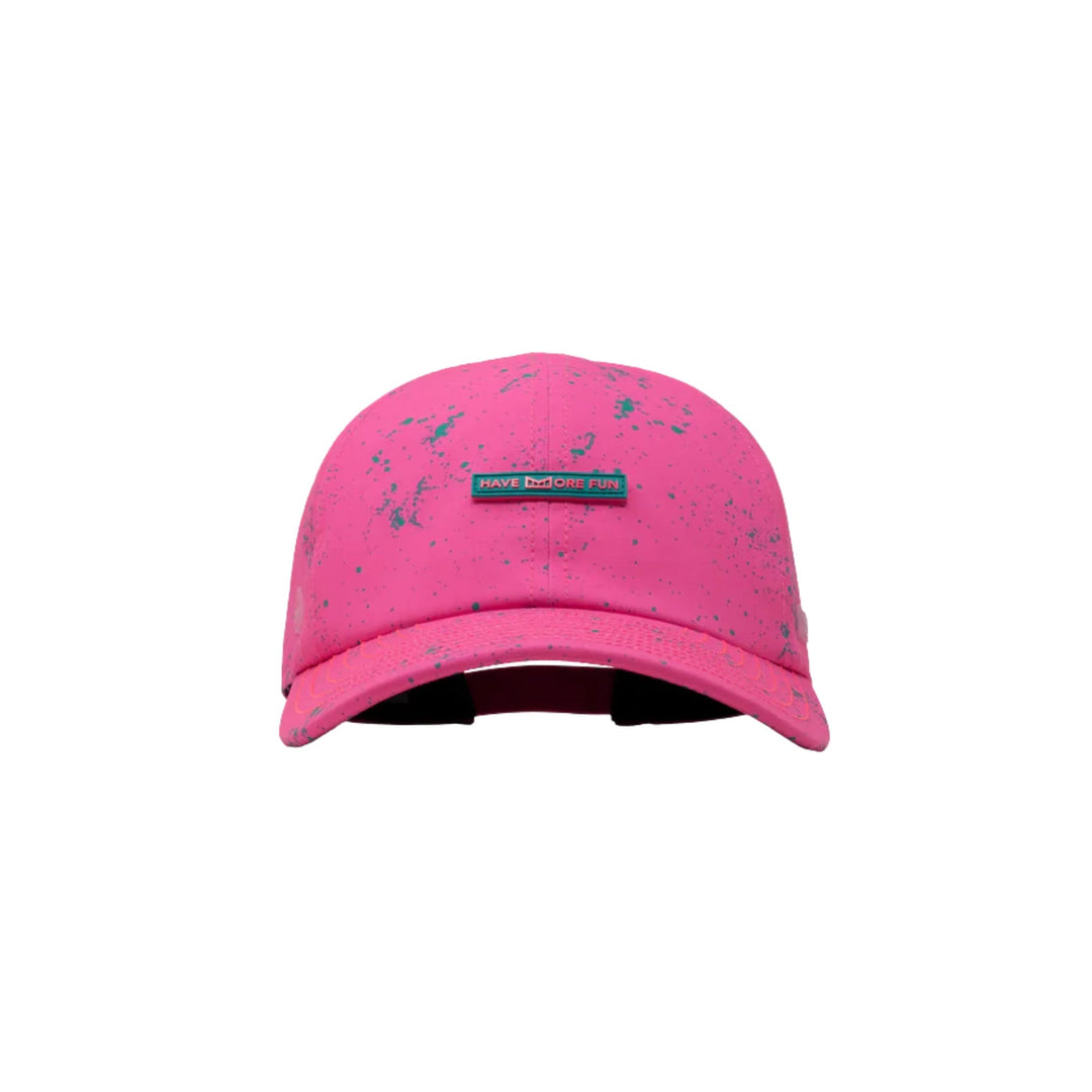 Hot pink baseball cap with teal speckled pattern and a front patch reading HAVE MORE FUN