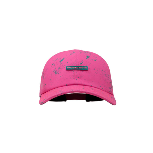 Hot pink baseball cap with teal speckled pattern and a front patch reading HAVE MORE FUN