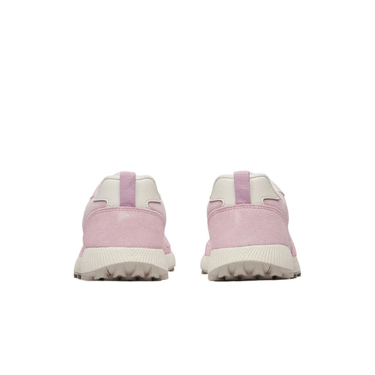 Pair of light pink slip-on shoes with white soles, shown from the back