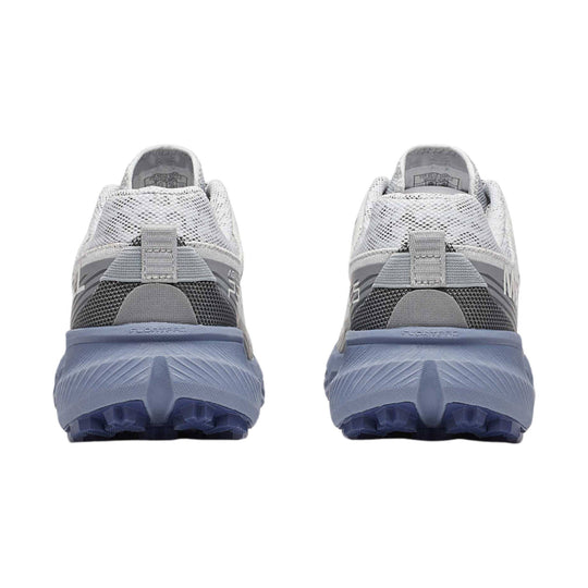 Pair of gray and white trail running shoes with chunky blue midsoles, shown from the back.