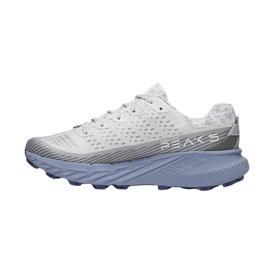 White and gray trail running shoe with blue outsole and visible side branding