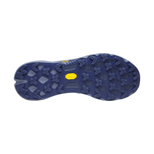 Blue trail running shoe outsole with lugged tread and a yellow Vibram Megagrip logo