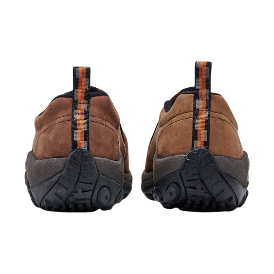 Brown suede slip-on shoes with black treaded soles, shown from the back