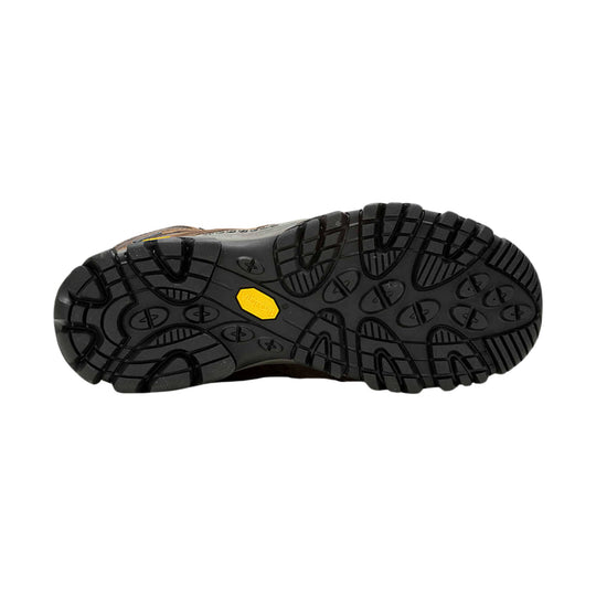 Black hiking boot outsole with deep tread and a yellow Vibram badge