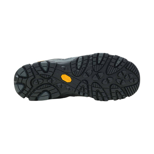 Black hiking shoe outsole with deep tread and a yellow Vibram logo