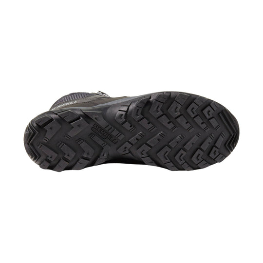 Black hiking boot sole with aggressive lug tread and Merrell branding