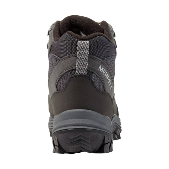 Rear view of a dark hiking boot with gray panels and a lugged sole