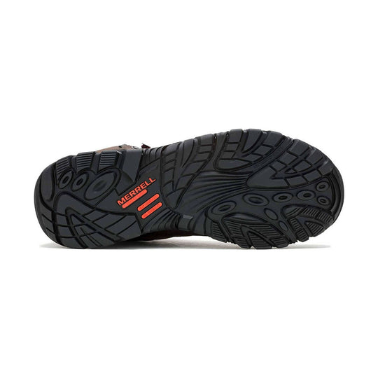 Black work boot outsole with deep tread and orange Merrell logo
