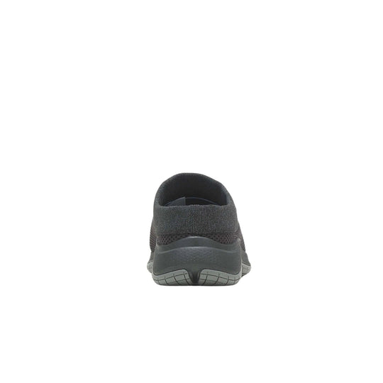 Black slip-on shoe shown from the back with knit upper, wide heel collar, and textured gray sole
