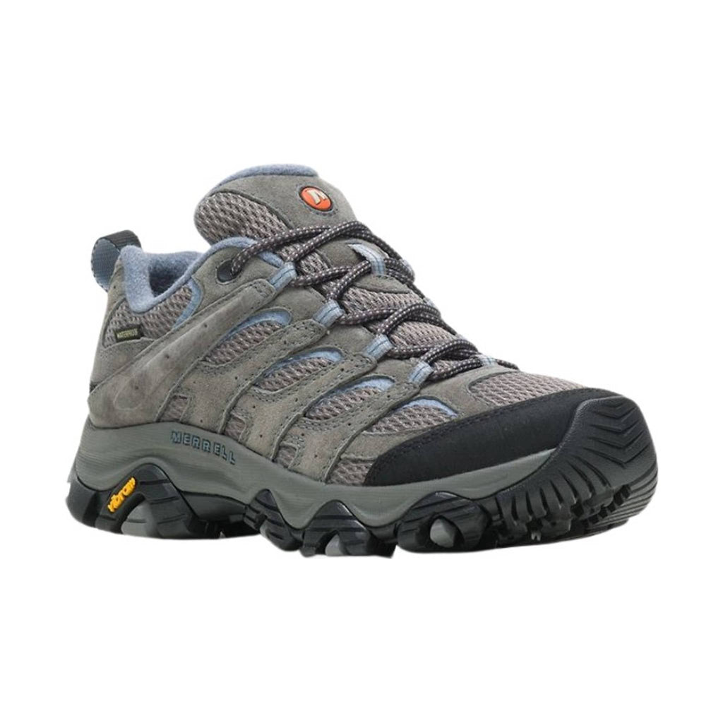 Gray hiking shoe with black sole on a white background